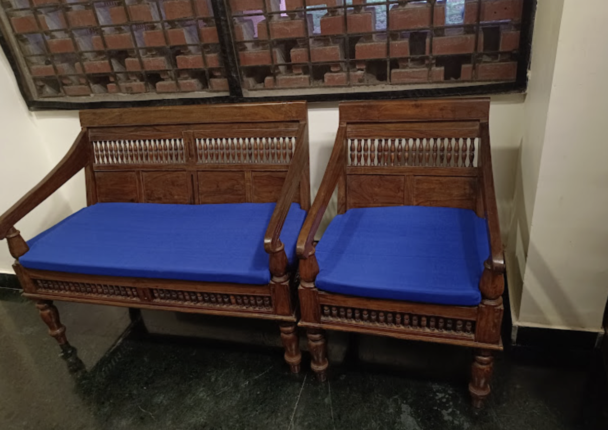 Antique Wooden Sofa with Blue Cushions