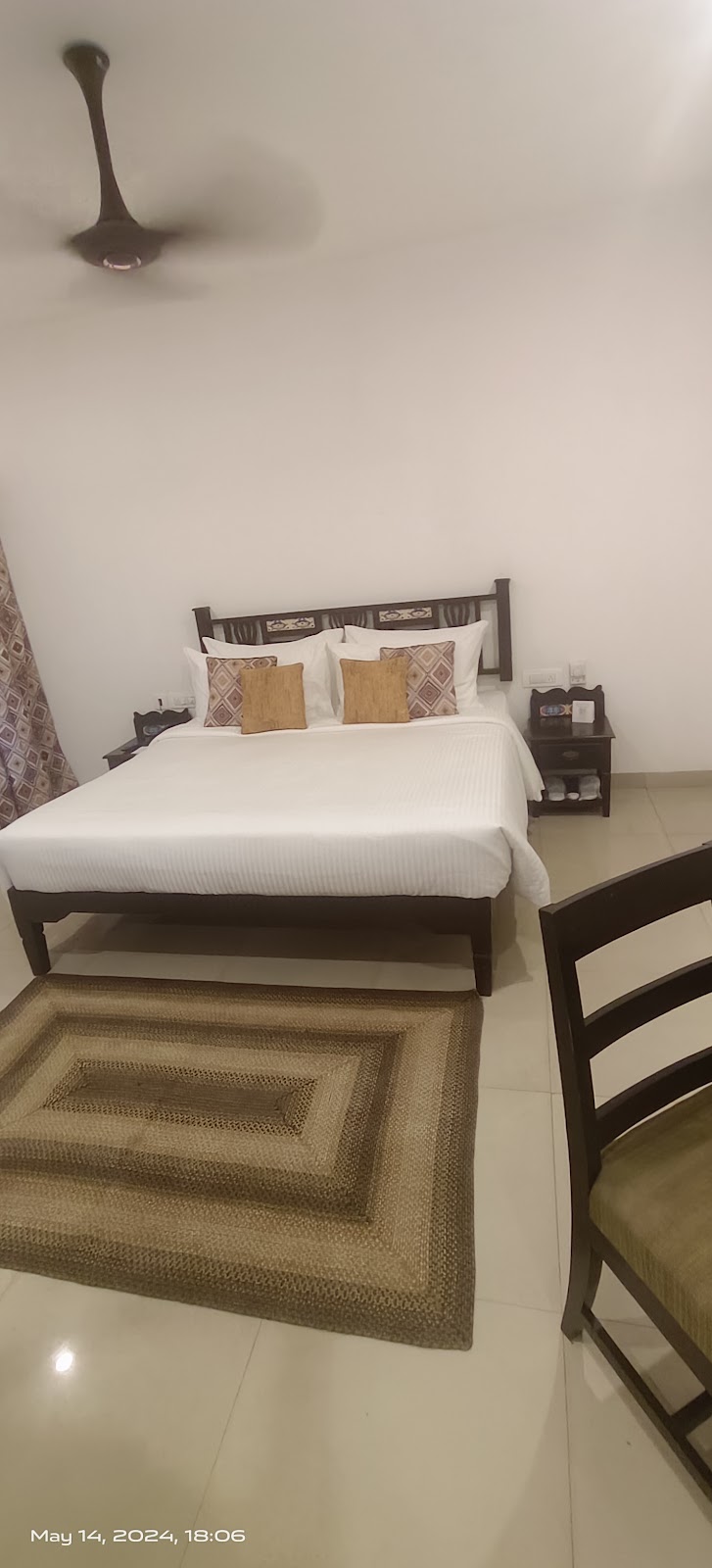 Wooden Bed With Woven Rug